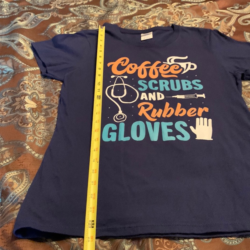 GUC  cute nurse shirt-no stains, holes, etc. Fun to wear. Cute compliments!